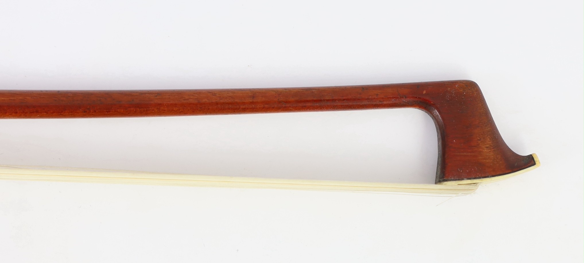 A silver mounted violin bow, stamped DODD, another stamped TOURTE and another bow